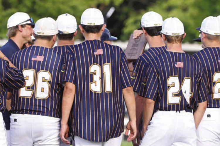 THE ST. PAUL JUNIORS are awarded the Class C Area 5 plaque after their 13-0 shutout victory over Palmer-Wolbach- Greeley last Tuesday evening at Silver Creek. Photos by Michael Happ