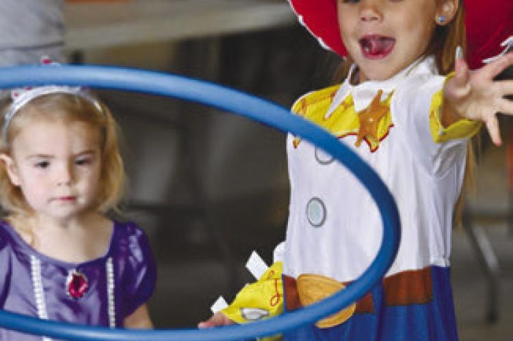 PAIGE NOWAK AND OAKLYNN HITCHLER were among the many kids who enjoyed the fun, games, and free candy at Farwell’s trick-or-treat event on Sunday. Photo by Michael Happ