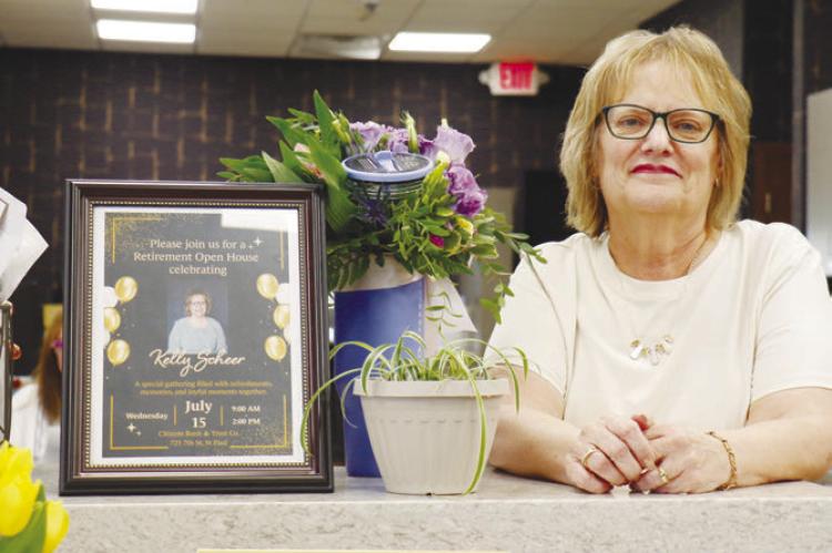 KELLY SCHEER was honored with a retirement open house at Citizens Bank &amp; Trust Co. in St. Paul last Wednesday. Scheer had been in banking for nearly five decades prior to her retirement. Photo by Michael Rother