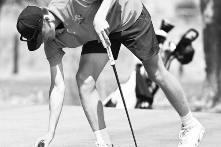 ST. PAUL’S JACKSON WEGNER lines up his putt during last month’s St. Paul Invite. Wegner finished last week’s District C-4 Meet as the runner-up following a playoff on the first hole at Southern Hills. Phonograph- Herald File Photo