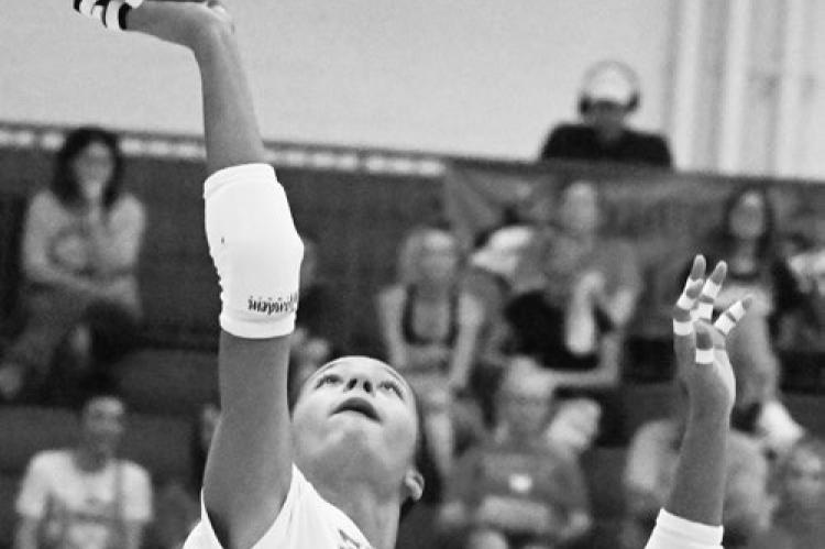 ZAYA LEWIS passes the ball over the net during the first set of last week’s match against Ord. Lewis had six kills in the match. Photo by Michael Happ