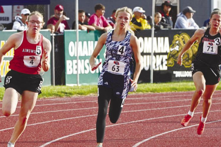 TAYLOR MCINTYRE makes the turn during the prelims of the 200-meter dash during the Friday session of the