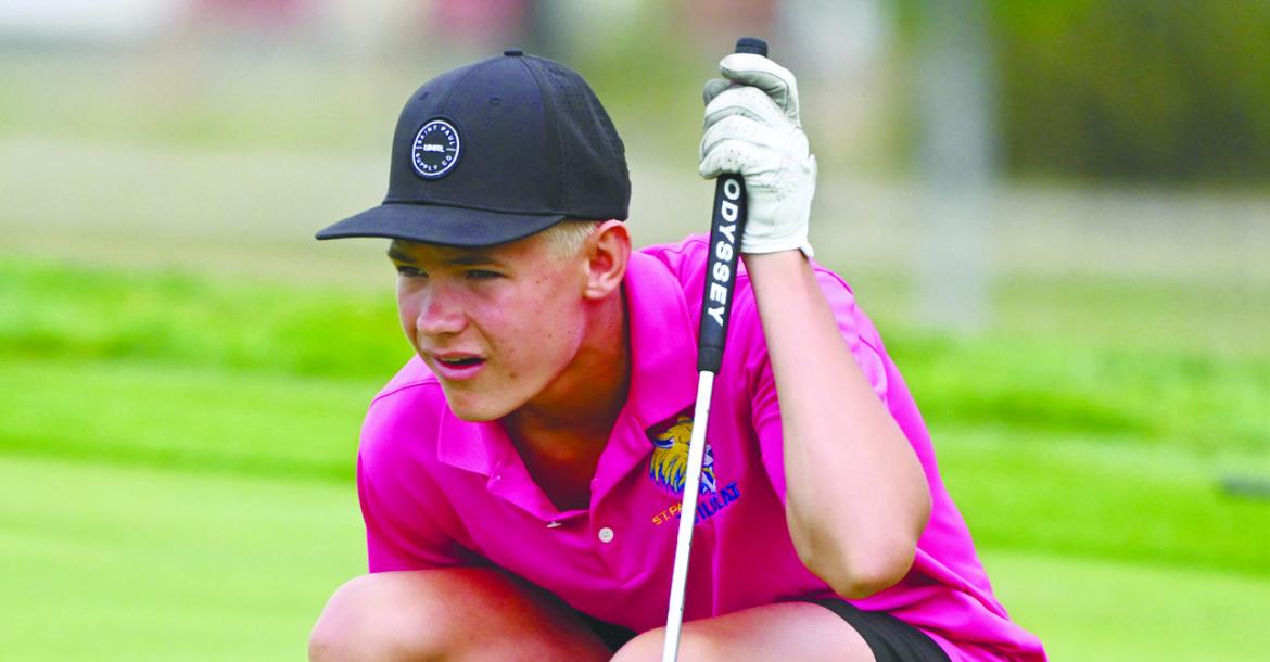 CASEN KAVAN lines up a putt on the sixteenth hole of Indianhead Golf Club in Grand Island on Thursday afternoon.