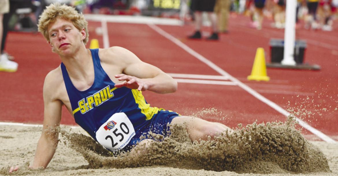 ST. PAUL’S Conner Douthit plows into the pit during the boys’ triple jump on Friday morning at the NSAA Class C State Track and Field Championships at Omaha’s Burke Stadium. Douthit placed second in the triple jump with a leap of 44-09.50. Photos by Michael Happ