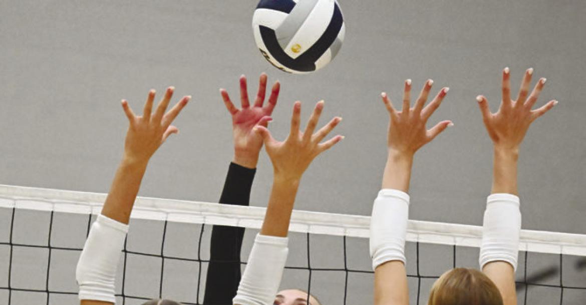 CENTURA’S ELLA FRANCL rises above St. Paul’s Adalynn Wells and Ariel Wells during the second set of last Tuesday’s match between the Centurions and the Wildcats. Photo by Michael Happ