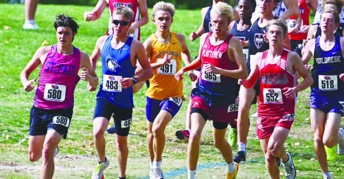 ST. PAUL’S ELI SLADEK races away from the start during the Class C boys state cross country meet last Friday in Kearney. Sladek set the pace early in the Class C boys’ race. Photos by Michael Happ