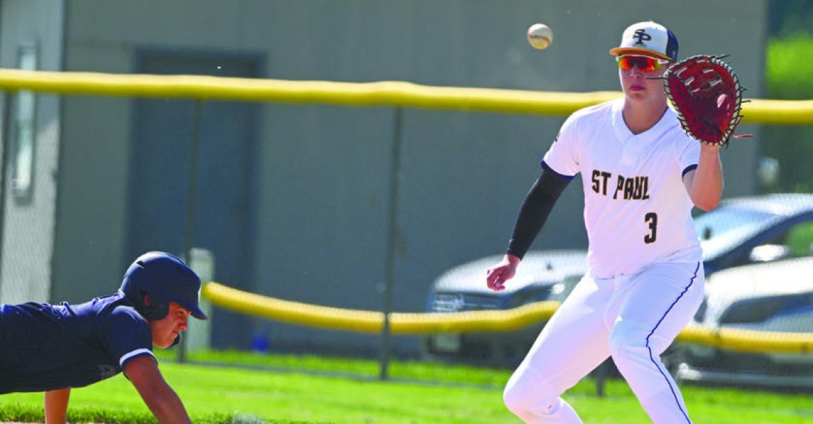 BRAXTON HEATER attempts to pick an opposing base runner off first base during a game against York late last month. St. Paul Post 119 has improved their record to 6-1 this season with three wins at Broken Bow over the weekend. Photos by Michael Happ