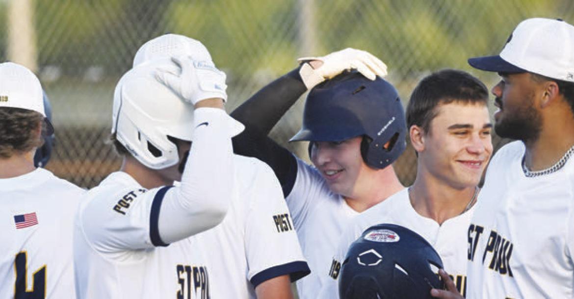 THE ST. PAUL SENIORS celebrate after one of their four home runs in last Thursday’s 13-0 win over Palmer-Wolbach-Greeley at Grover Cleveland Alexander Field in St. Paul. Photos by Michael Happ
