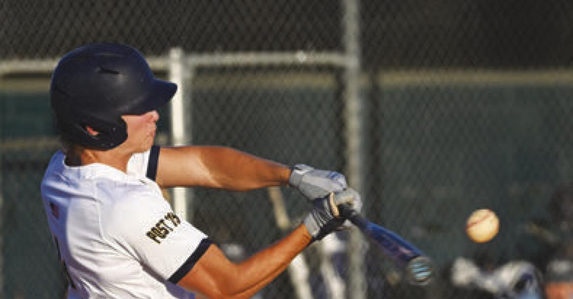 CHRISTIAN LEMBURG launches the ball to left field for a home run in the second inning of St. Paul’s game with PWG.