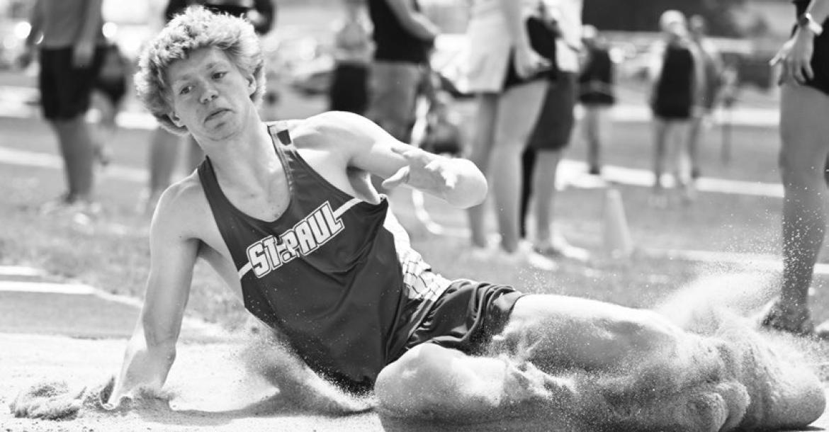 ST. PAUL’S CONNER DOUTHIT planted his feet at 44-02.25 on Thursday to win the gold medal in the boys’ triple jump. Douthit also won the long jump at the district meet, and qualified in the high jump after he placed second. Photos by Michael Happ
