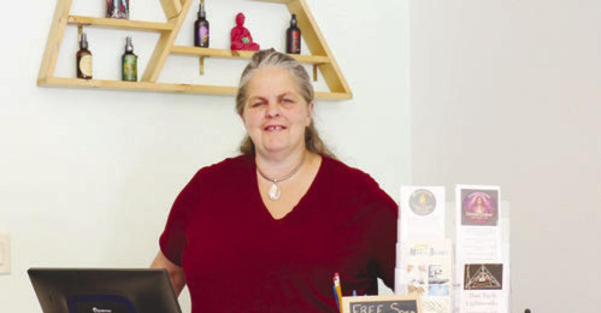 KATANA RAY stands behind the counter of Running Wolf Originals’ new storefront shop in St. Paul last week. The St. Paul location officially opened on June 19th. Photo by Michael Rother