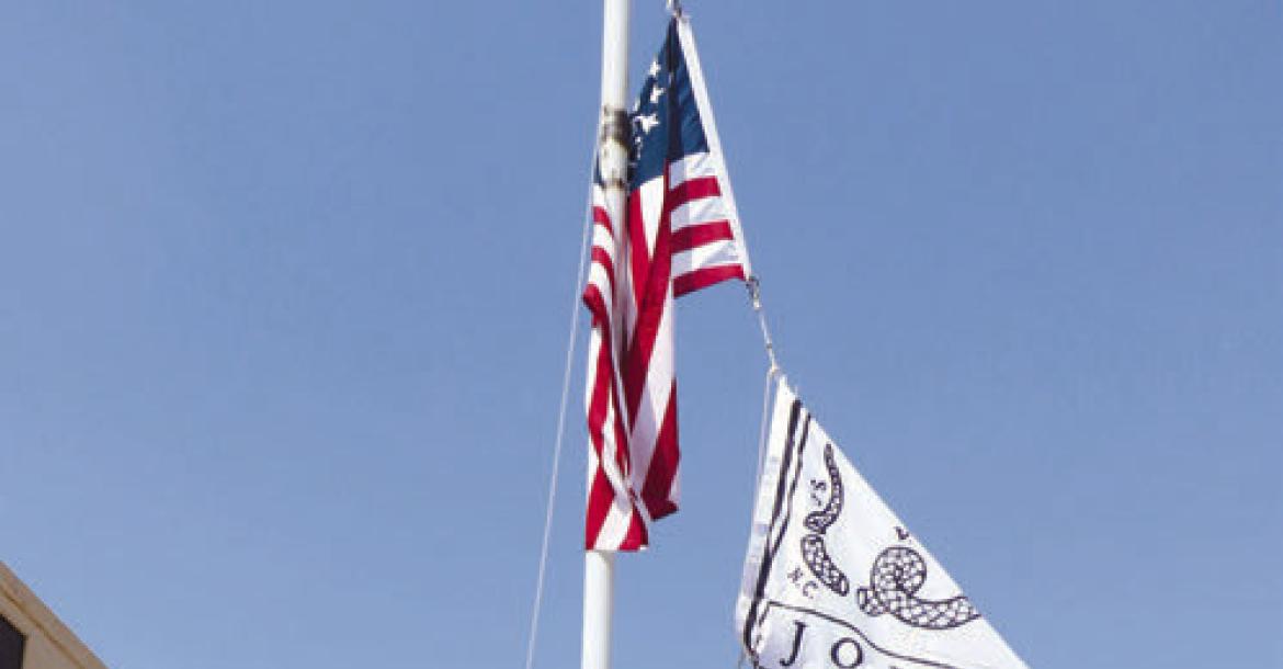 THE FLAG POLE outside of Loup River Distilling has been adorned with myriad flags from manager and distiller Eric Montemagni’s personal collection throughout the year. Montemagni began flying the flags to celebrate the country’s 250th birthday. Photos by Michael Rother