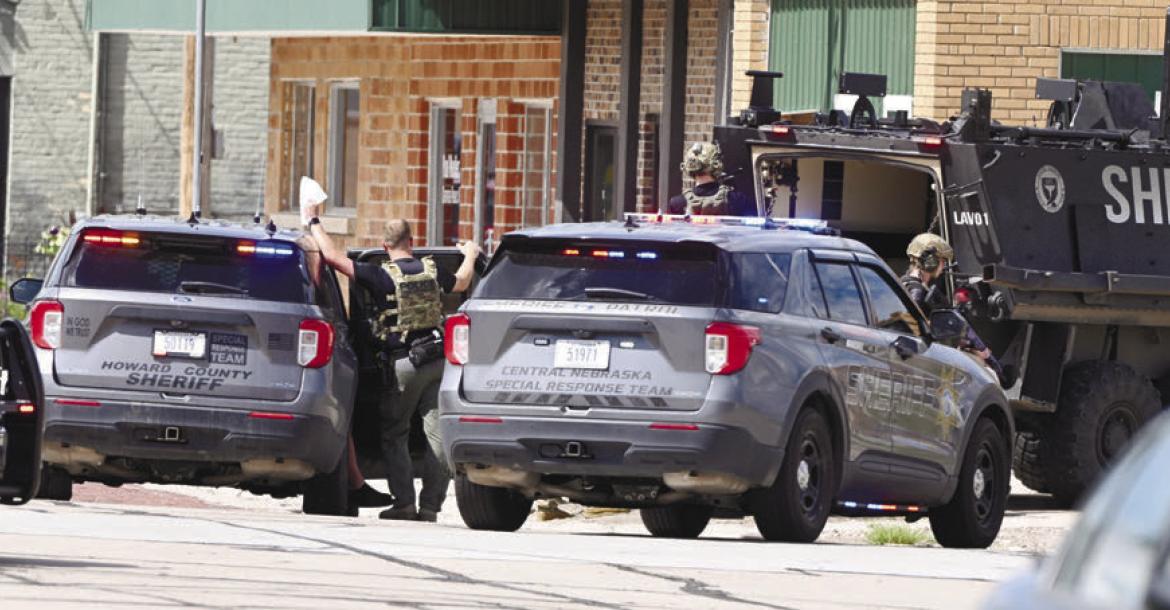 MEMBERS of Central Nebraska Special Response Team assisted the Howard County Sheriff’s Office in serving a search warrant at 704 7th Street on Sunday afternoon. Photos by Michael Happ