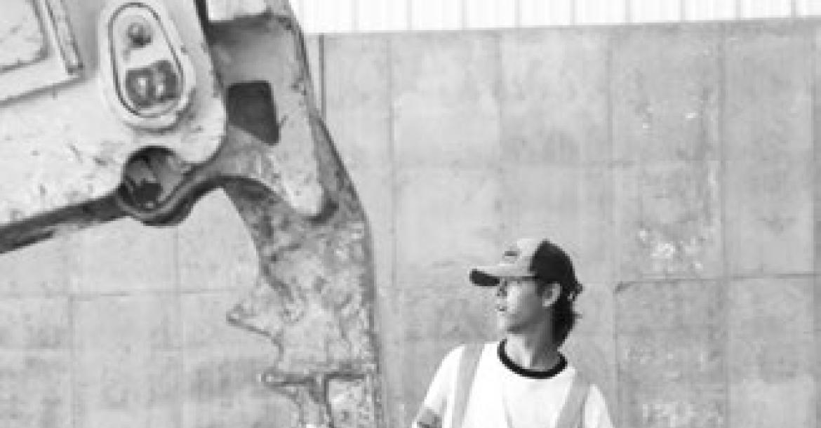 BRENDAN MULLER helps sort through scrap within the Loup Central Landfill Association’s new recycling facility.