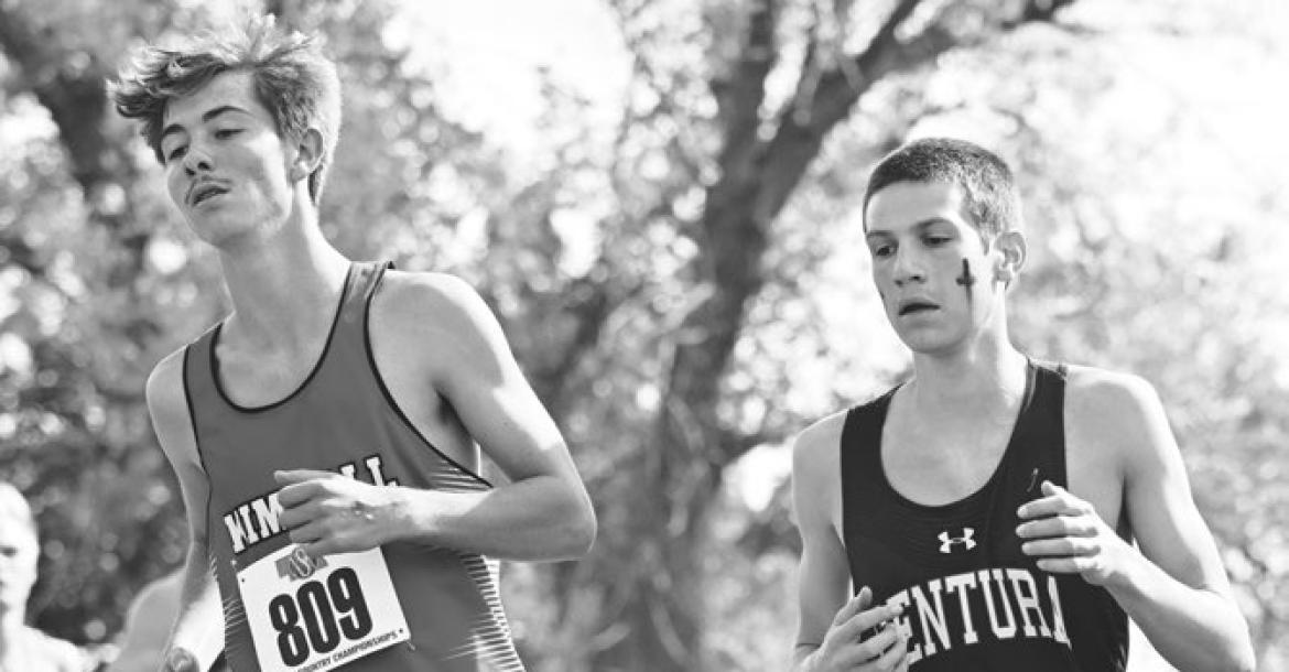 CENTURA’S KASEN WEBB makes a curve midway through Friday’s Class D state championship race on the course at the Kearney Country Club. Webb placed sixtieth in the field at the state cross country meet. Photo by Michael Happ