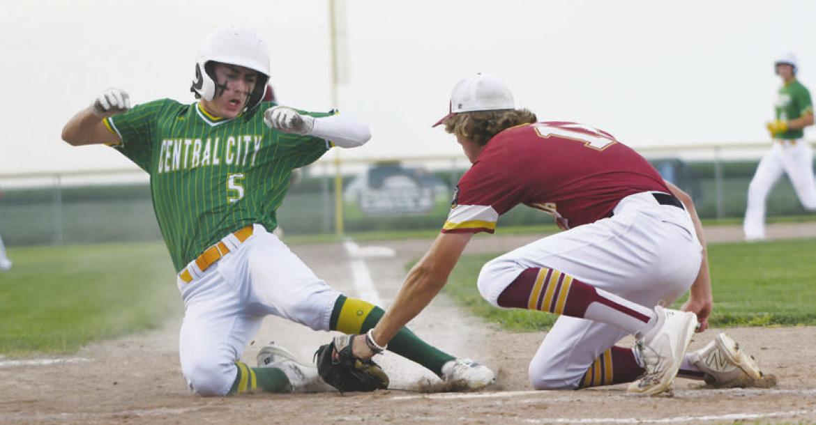 BARRETT FRIES tags out Central City’s Luke McHargue on a close play at the plate last Thursday. Fries pitched a complete game and led Centura with two hits in their 5-1 loss to Central City. Photos by Jordan Coslor