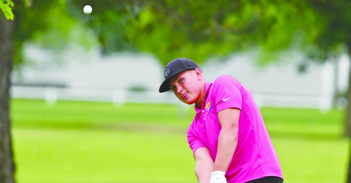 SAWYER KAVAN chips on to the second green at Indianhead Golf Club during the junior’s final round at the state golf tournament. Photo by Michael Happ