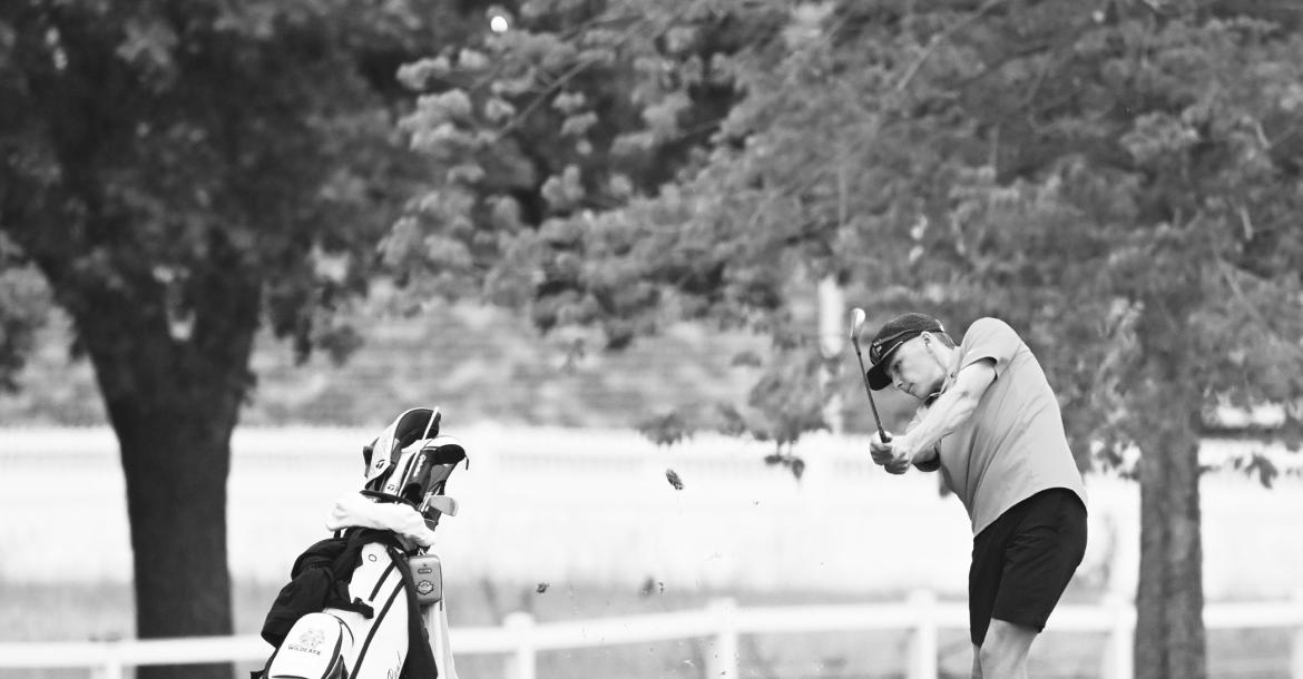 JACKSON WEGNER fires from the ninth fairway to the green during the front nine at the NSAA Class C State Golf Championships in Grand Island on Thursday. Photos by Michael Happ