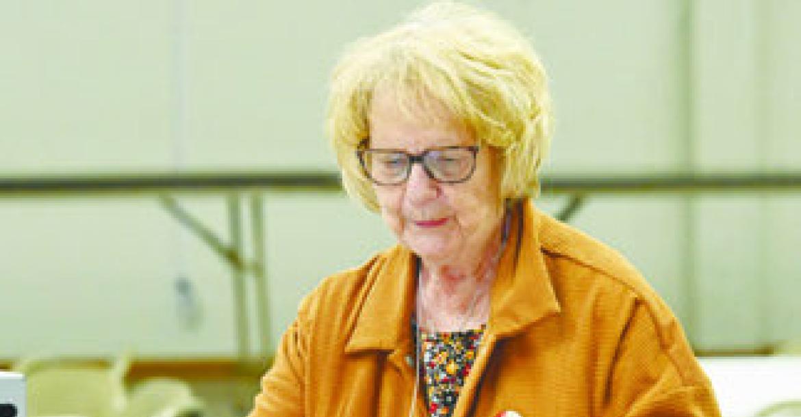 POLL WORKER MARLENE CASPERSEN helped man the polling site at Boelus during the Tuesday, May 12th primary election. Photo by Michael Happ