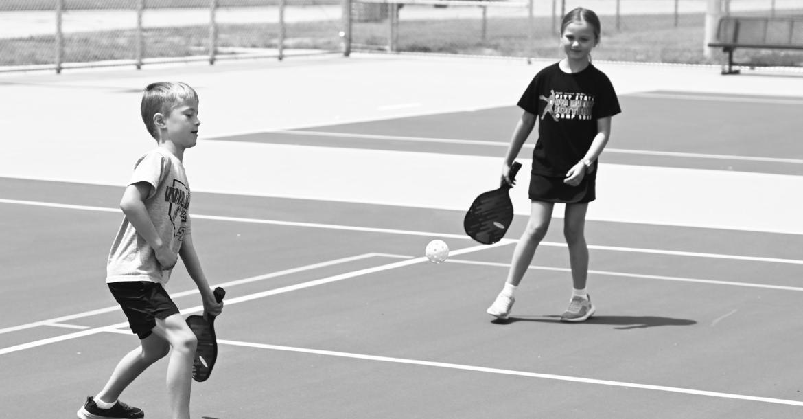 THE NEW TENNIS AND PICKLEBALL COURTS near Grover Cleveland Alexander Field officially opened to the public on Tuesday, June 16th. The courts were part of numerous park improvements in the city paid for via an $875,000 award from the Nebraska Department of Economic Development’s Rural Community Recovery Program. Pictured above, Jack and Lainey Meyer enjoy a game of pickleball on opening day.