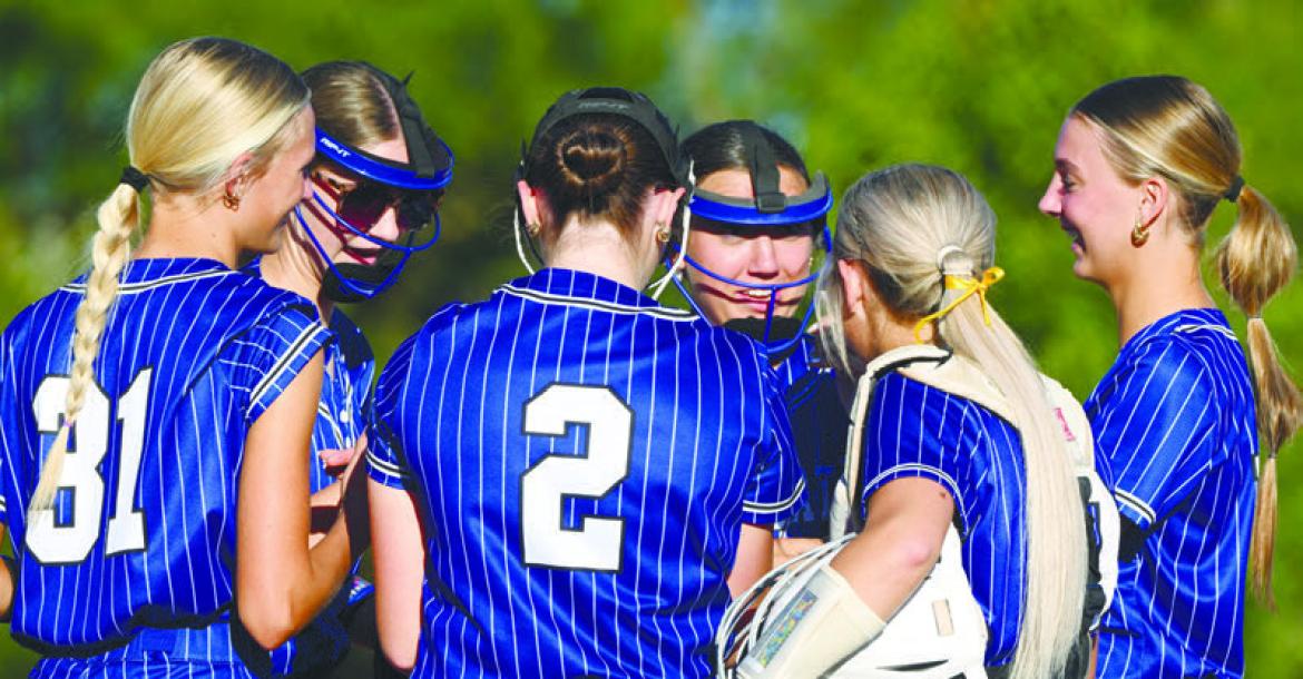 MEMBERS of the St. Paul softball team were all smiles as they entered the bottom half of the first inning against Centennial with a one-run lead on Thursday. St. Paul ultimately lost that game 13-5. Photos by Michael Happ