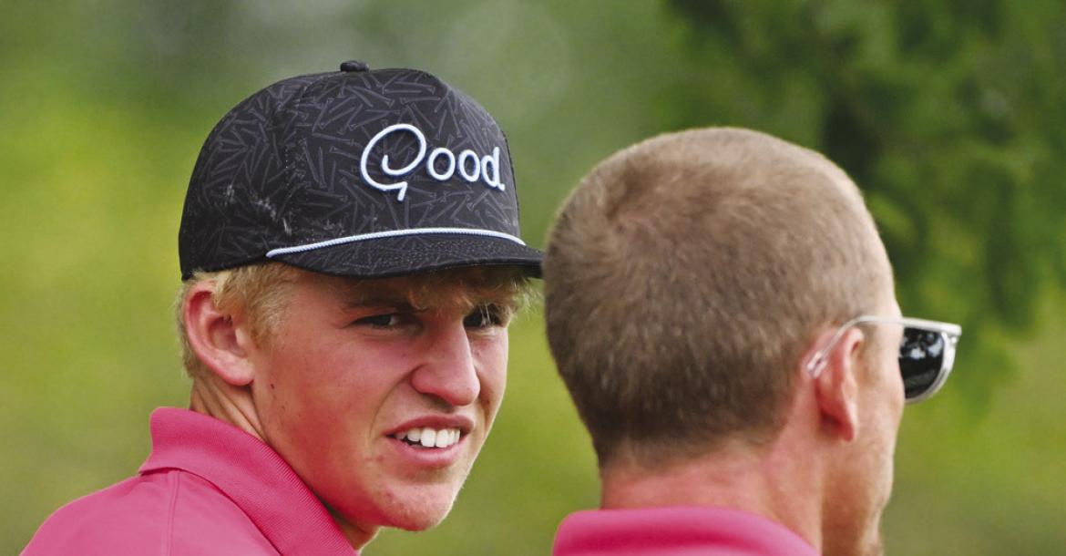 BEAU PARO discusses a shot with Assistant Coach Logan Almond on the fourteenth green last week.