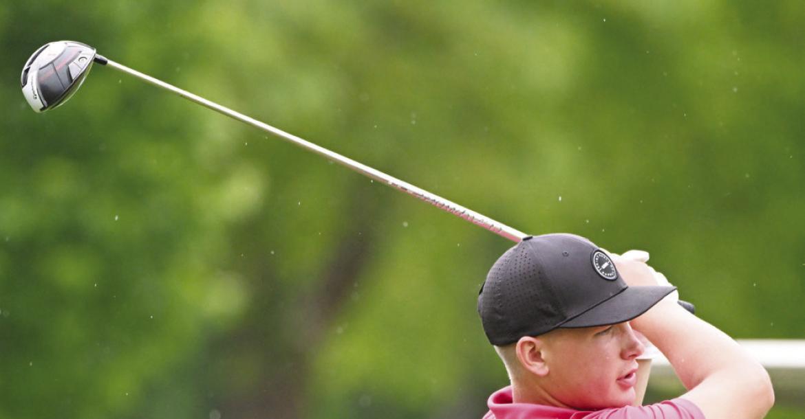SAWYER KAVAN watches his tee shot on the third hole of his back nine on Thursday afternoon in Grand Island.
