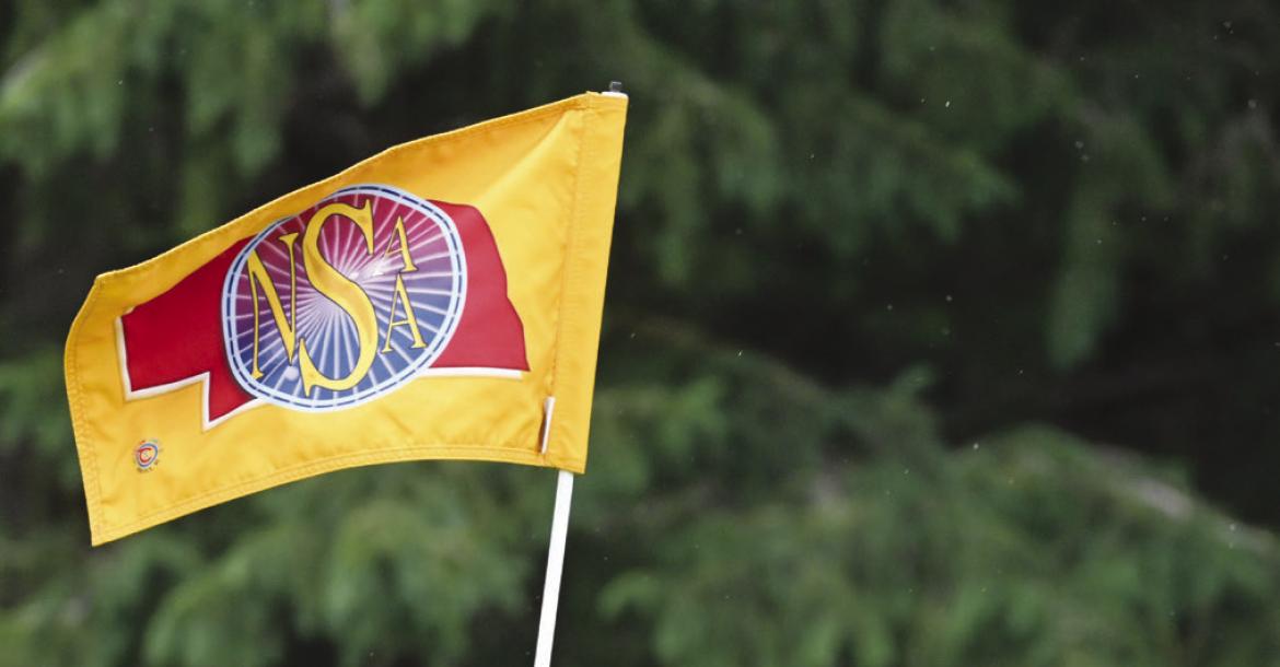 MADDOX QUINN replaces the flag on the seventh green at the Indianhead Golf Club last week during the state meet.