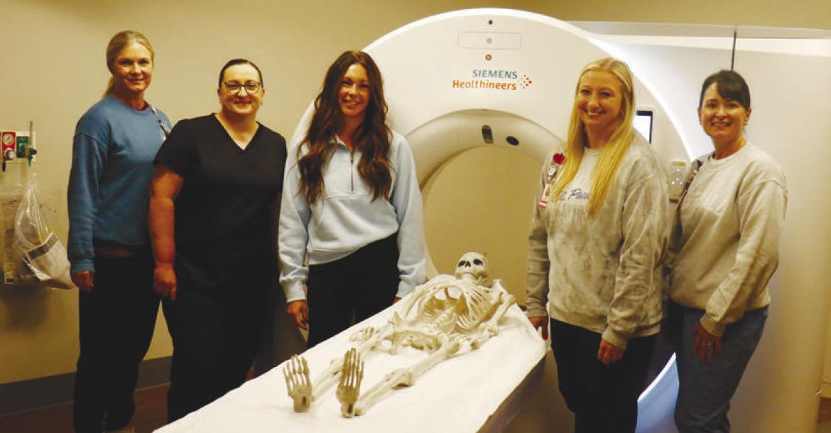 HOWARD COUNTY MEDICAL CENTER recently purchased a new CT machine. Pictured with the machine in the medical center’s new CT suite are Brandie Rosander, Mariah Quiring, Autumn Wegner, Nicole Coufal, and Holly Sack. Photo by Michael Rother