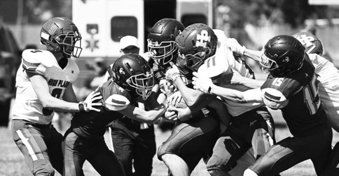 COLIN BRAHATCEK attempts to move the ball against High Plains’ defense during the first quarter of Friday afternoon’s game between the Bluejays and the Storm. Photos by Michael Happ