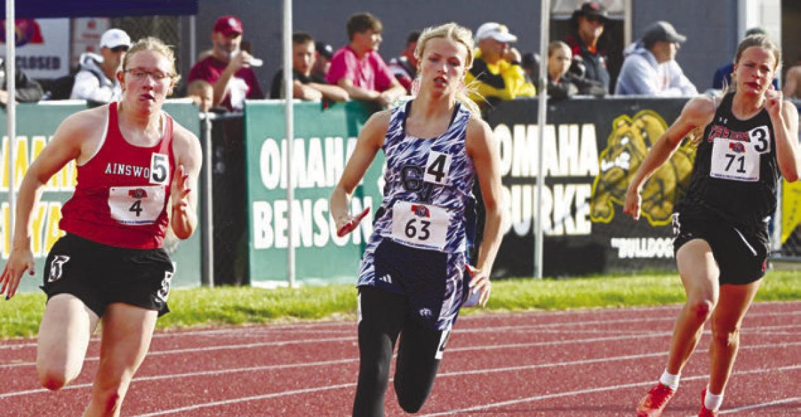 TAYLOR MCINTYRE makes the turn during the prelims of the 200-meter dash during the Friday session of the